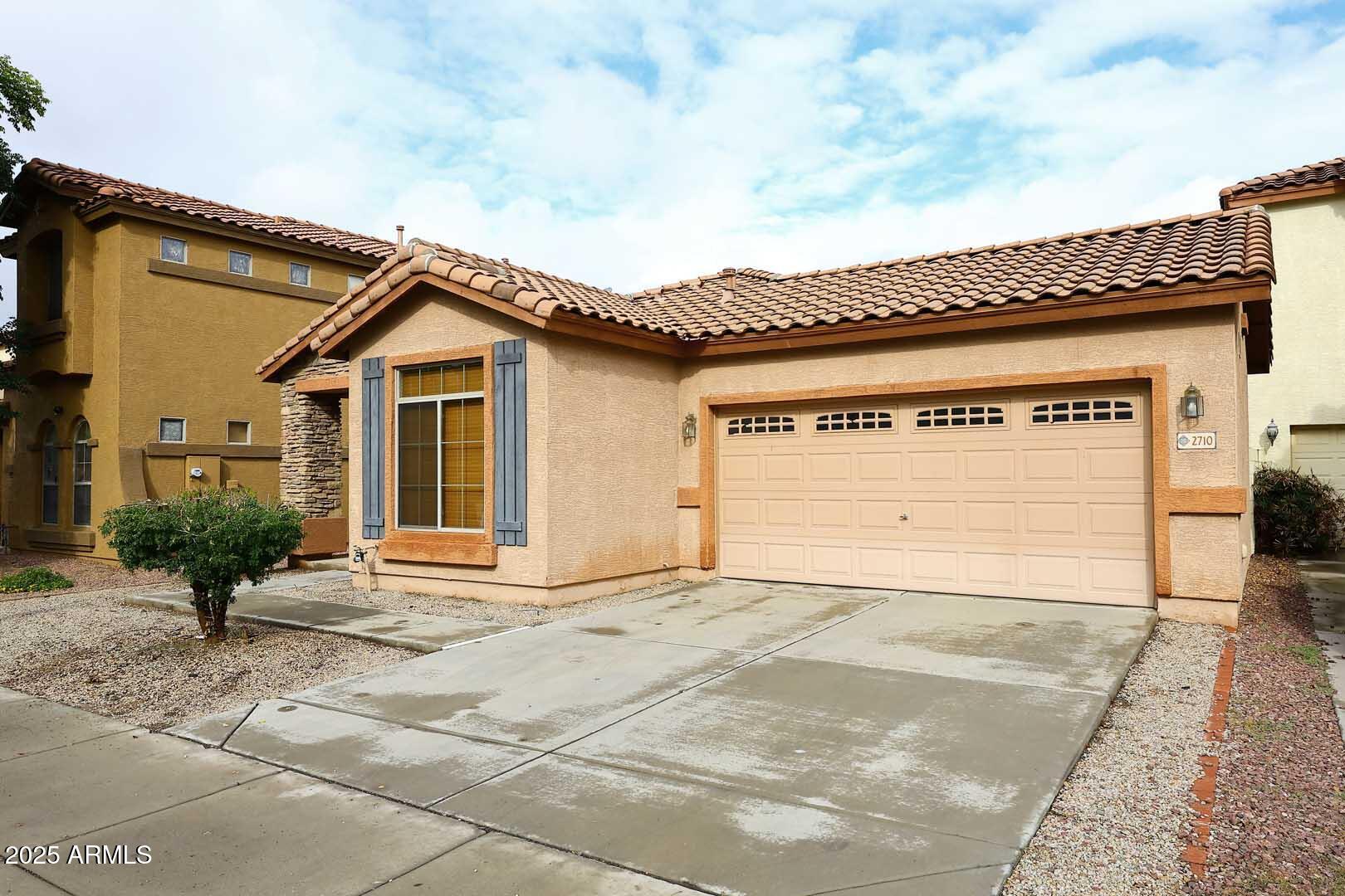2710 East Chester Drive Chandler, AZ 85286 - Photo 2 of 28 a front view of a house with a garage