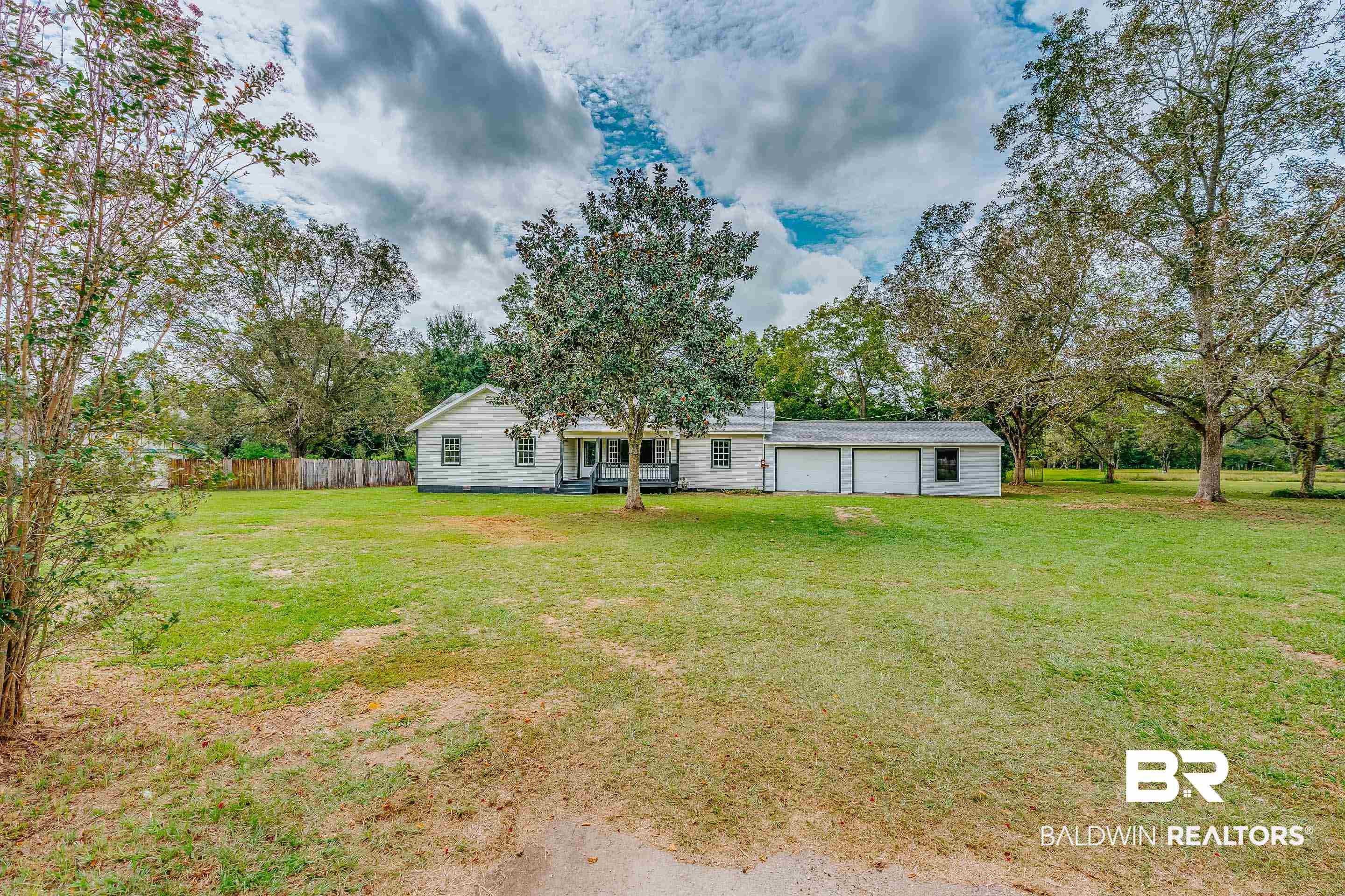 8001 16th Street Irvington, AL 36544 - Photo 30 of 35 View of yard with view of wooded area and a patio area
