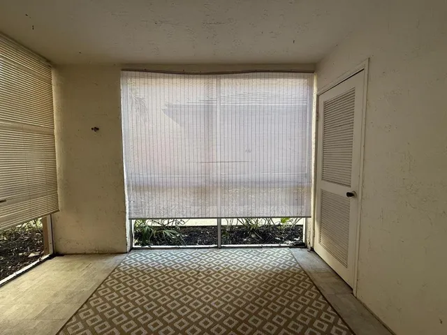 a bathroom with a glass door shower