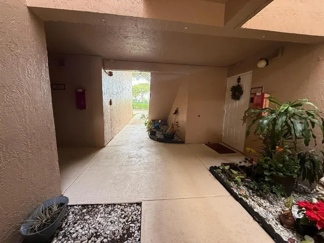 a room with water heater and wooden floor