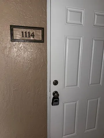 a view of a street with a car parked