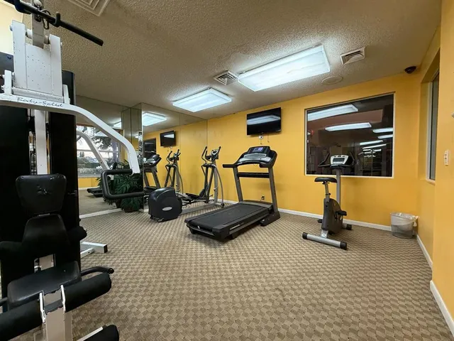 a view of a park with swings and slides