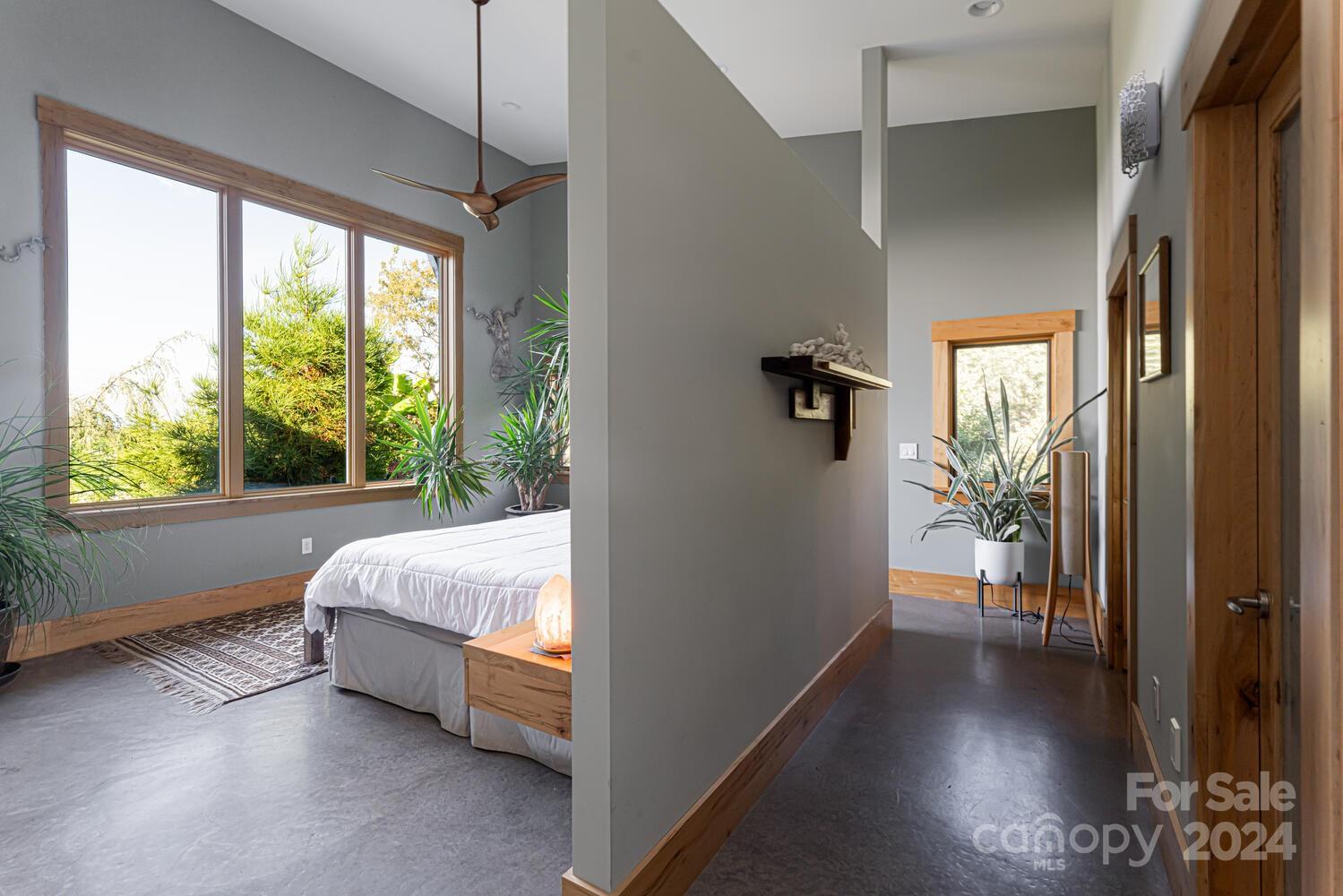 265 Alexander Road Alexander, NC 28701 - Photo 14 of 48 a bed room with a bed and a window