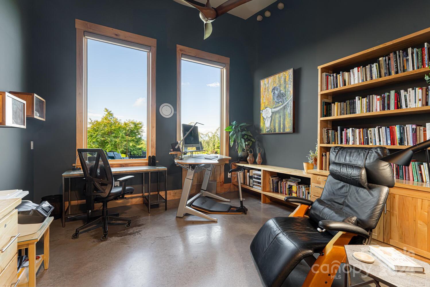 265 Alexander Road Alexander, NC 28701 - Photo 19 of 48 a living room with furniture a bookshelf and a window