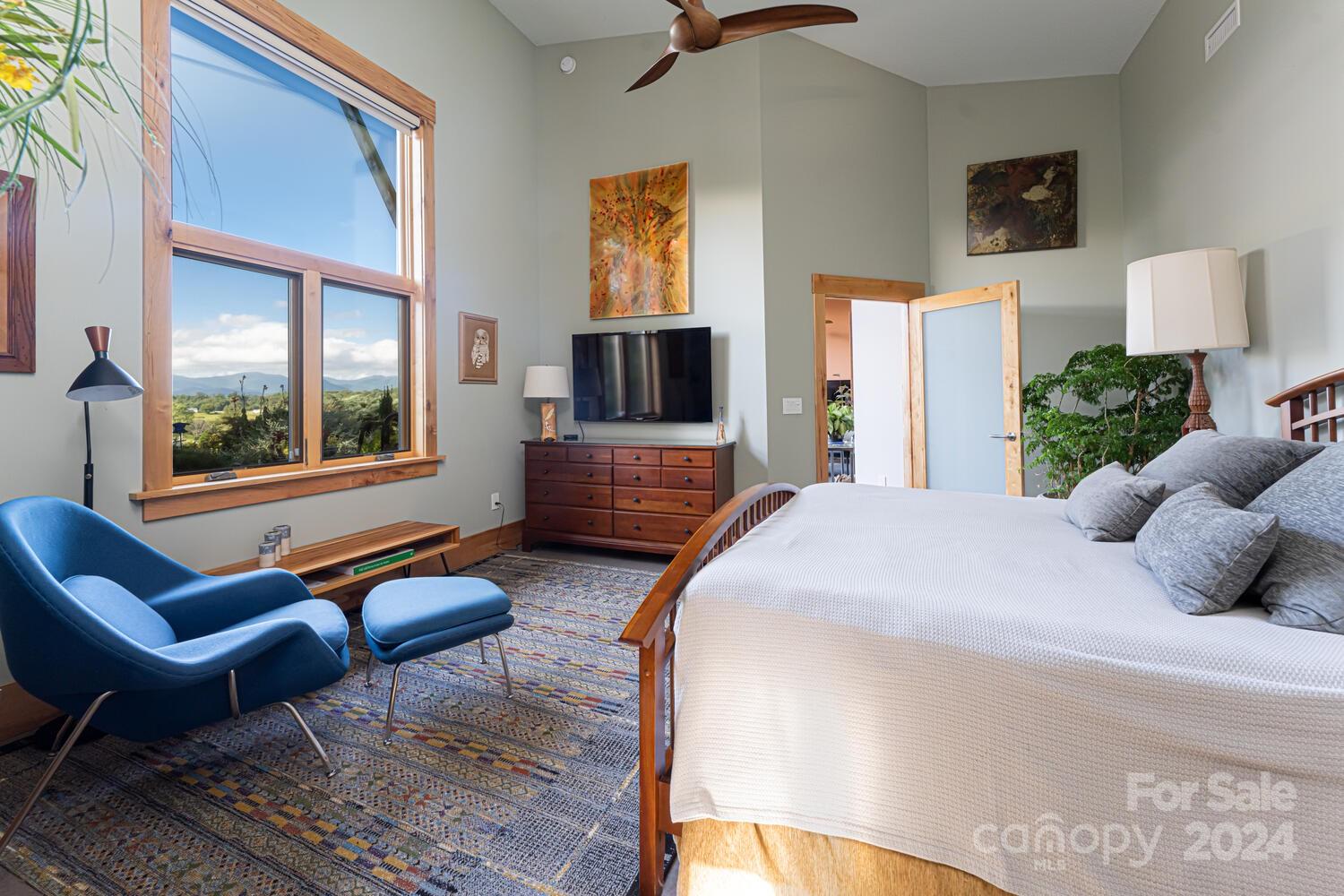 265 Alexander Road Alexander, NC 28701 - Photo 21 of 48 a bedroom with a bed a couch and a window