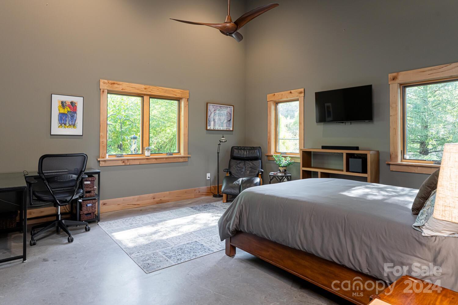 265 Alexander Road Alexander, NC 28701 - Photo 24 of 48 a bedroom with a bed and a flat screen tv