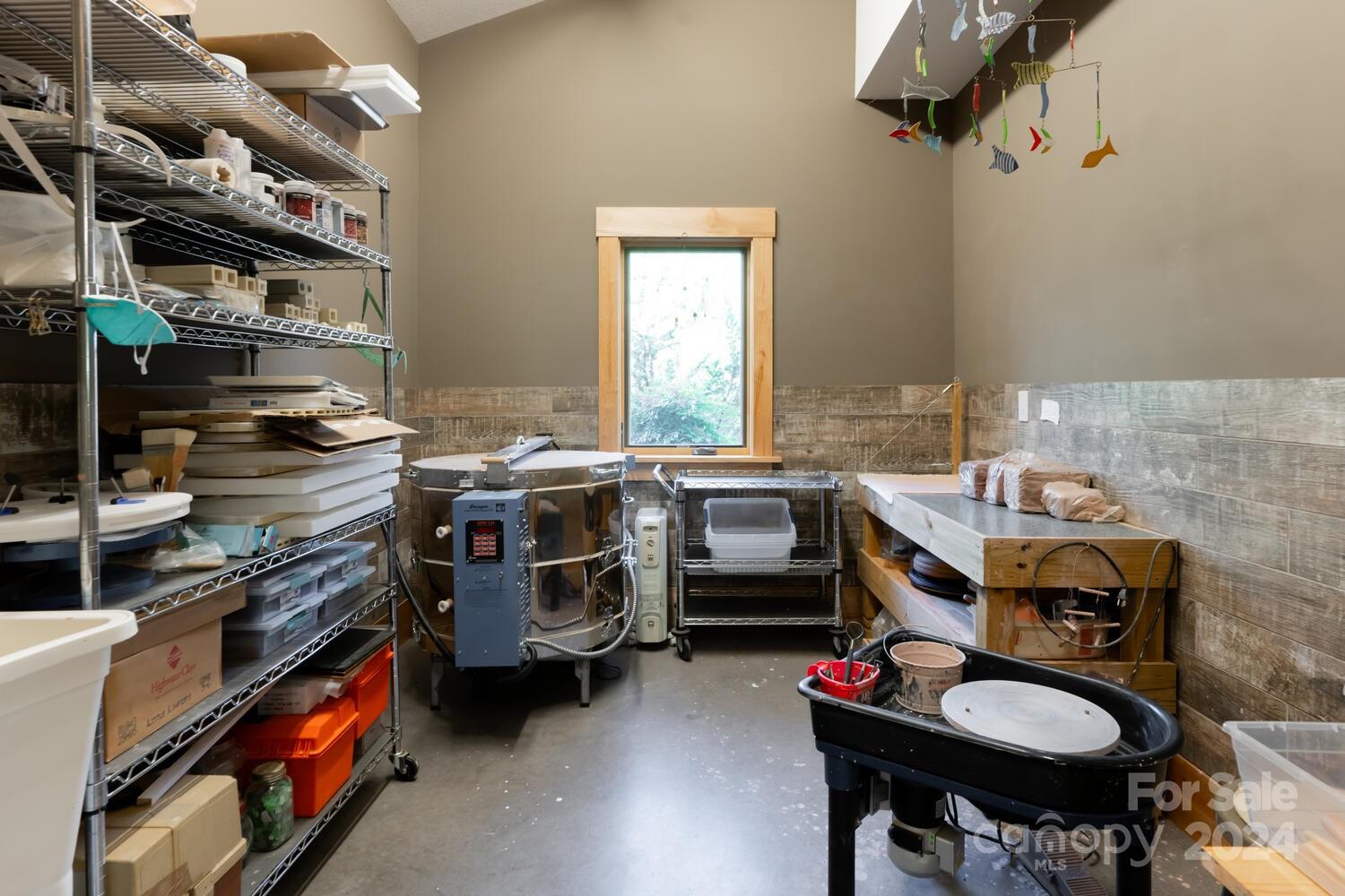 265 Alexander Road Alexander, NC 28701 - Photo 28 of 48 a utility room with a stove top oven