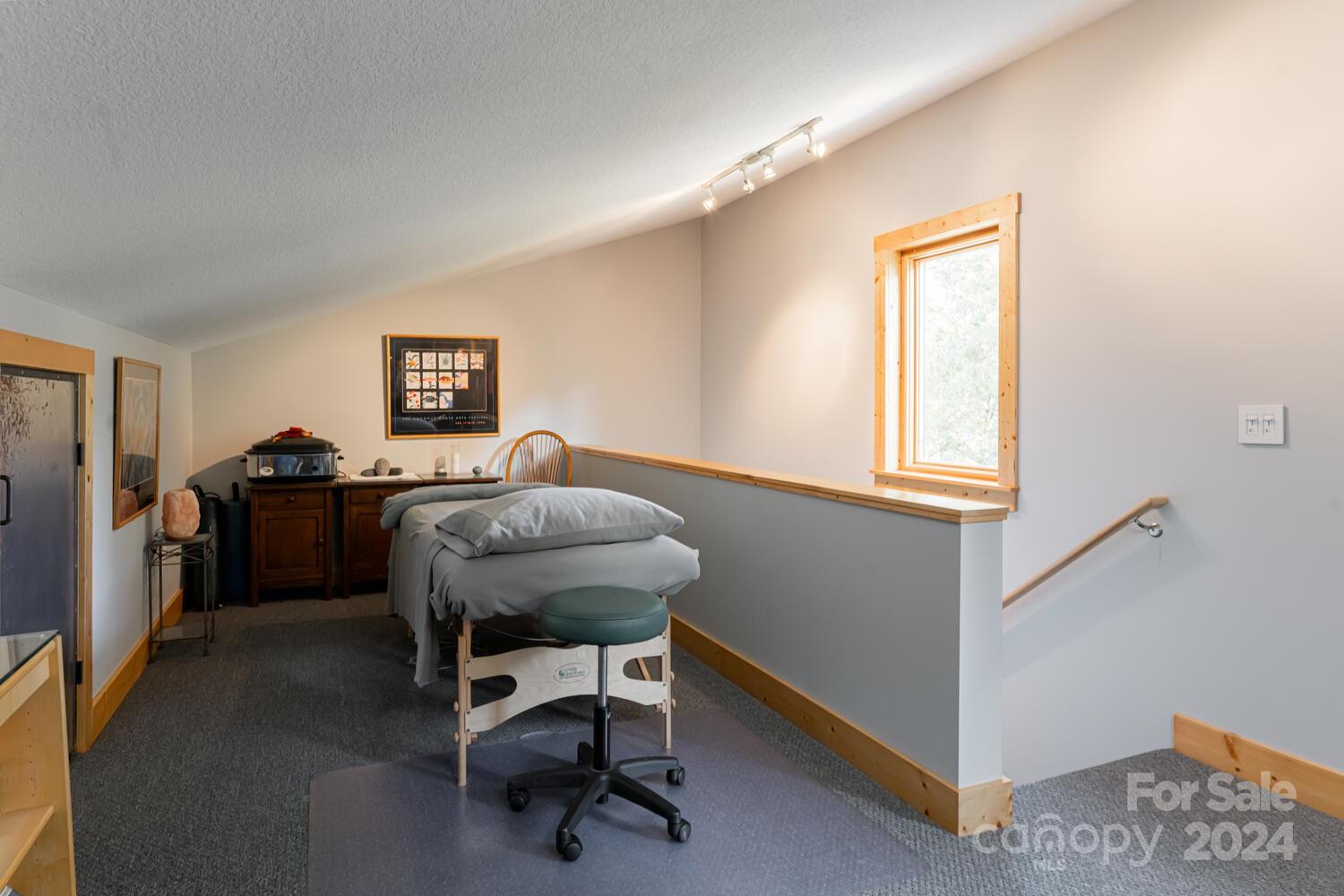 265 Alexander Road Alexander, NC 28701 - Photo 30 of 48 a view of a workspace with furniture and a window