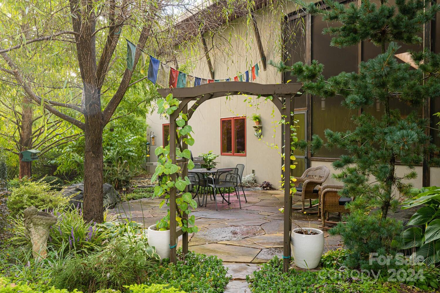 265 Alexander Road Alexander, NC 28701 - Photo 33 of 48 a front view of a house with garden