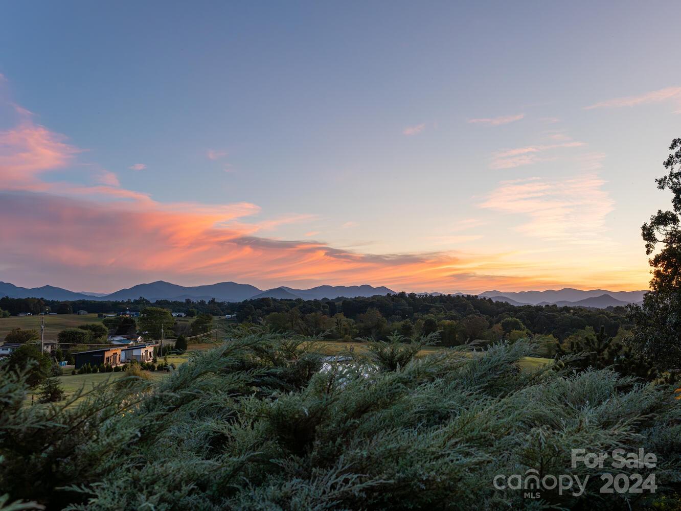 265 Alexander Road Alexander, NC 28701 - Photo 6 of 48 a view of a city with sunset