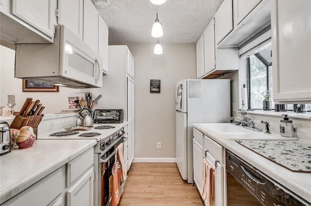 404 Franklin Boulevard, Unit B Austin, TX 78751 - Photo 1 of 1 a kitchen with stainless steel appliances granite countertop a sink stove and refrigerator