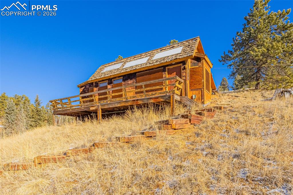 69 Snowberry Creek Road Florissant, CO 80816 - Photo 13 of 16 a view of a building with mountains