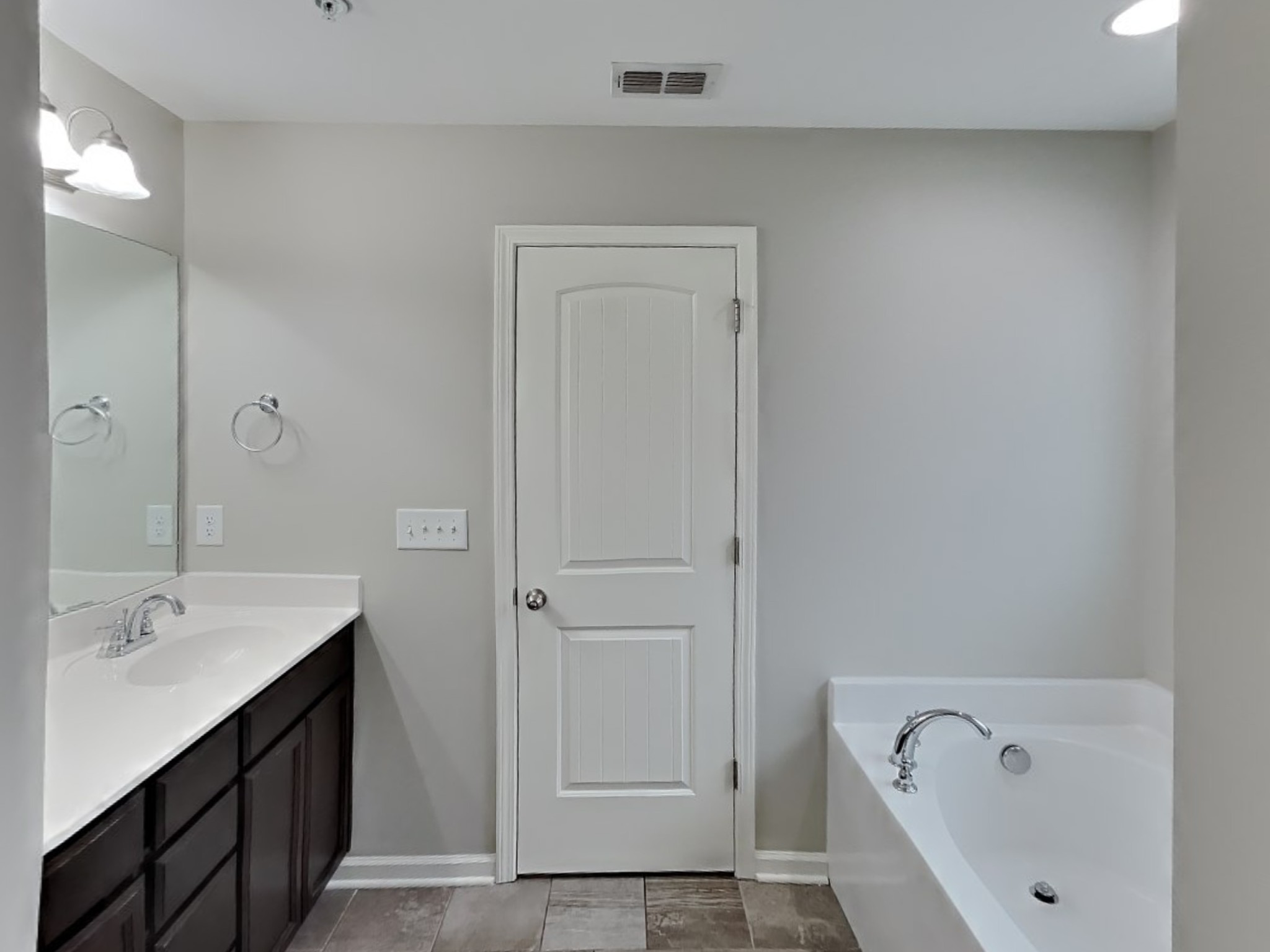 1093 Neeleys Bend East Spring Hill, TN 37174 - Photo 8 of 16 a bathroom with a bathtub and a sink