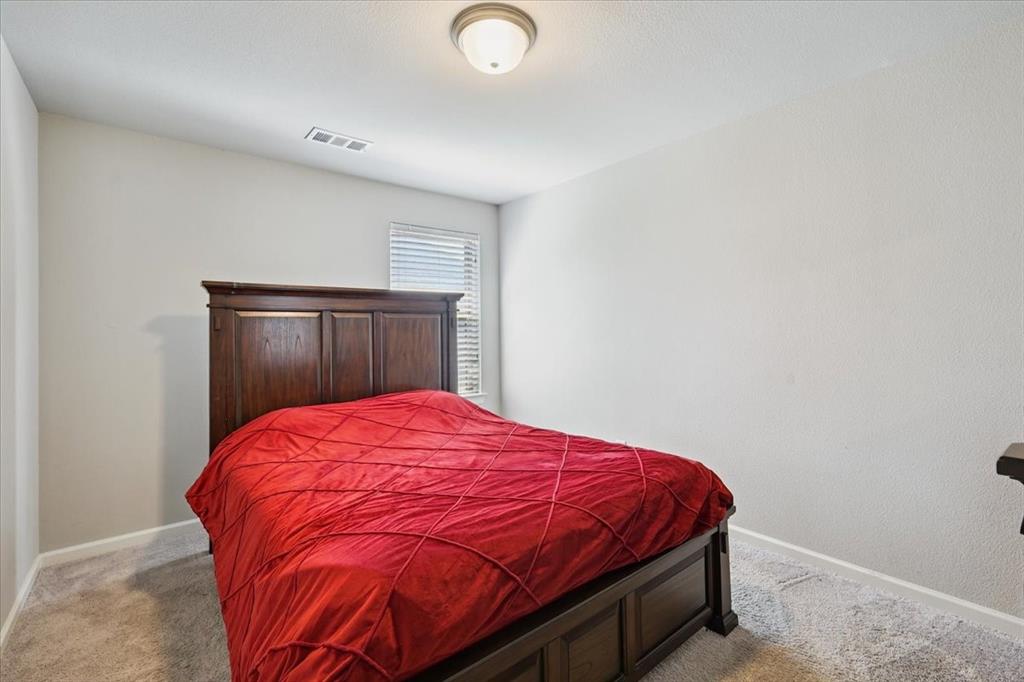 345 Greenbriar Road Little Elm, TX 75068 - Photo 15 of 20 Bedroom with light colored carpet
