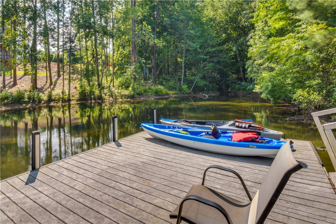 206 Petty Road Seneca, SC 29672 - Photo 3 of 48 A tranquil private pond with a dock awaits, perfect for leisurely paddles and quiet moments.
