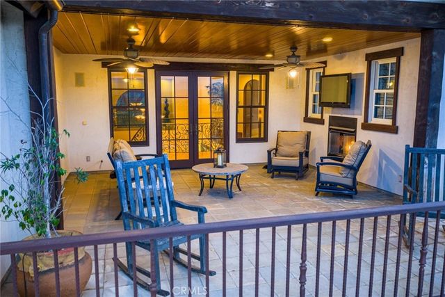 a living room with furniture and a large mirror