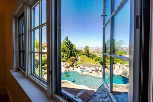 a view of a patio with table and chairs and potted plants