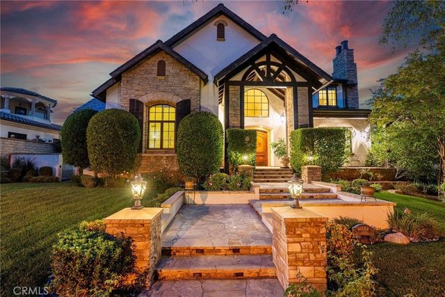 a living room filled with furniture hardwood floor and a table
