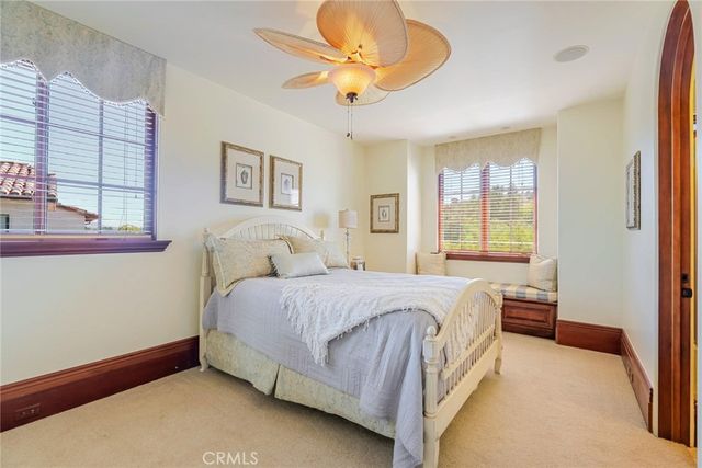 an aerial view of a house with swimming pool garden and patio