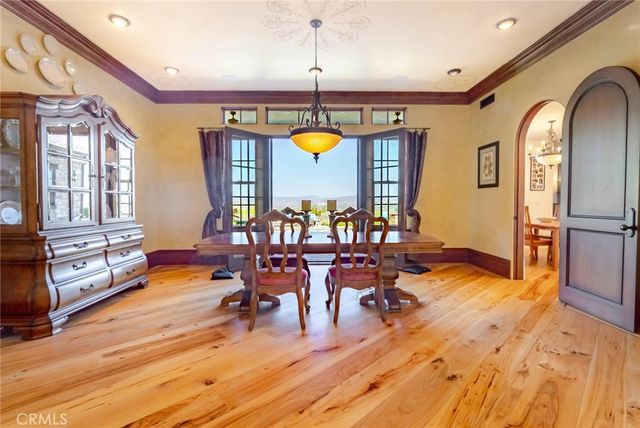 a view of a dining area with furniture window and wooden floor