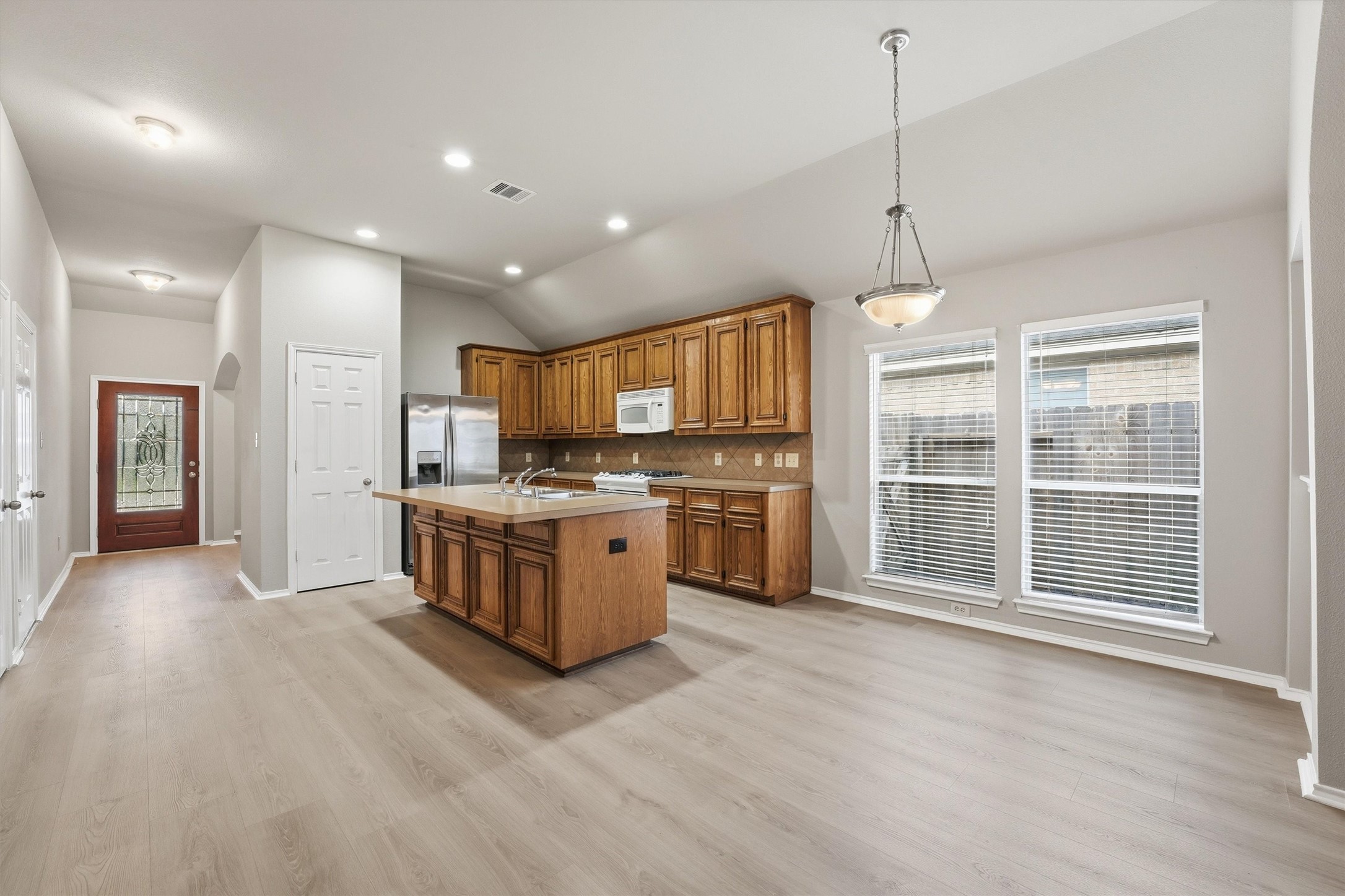 20931 Hamlet Ridge Lane Katy, TX 77449 - Photo 9 of 23 Fabulous flow provides generous space ideal for cooking and entertaining.