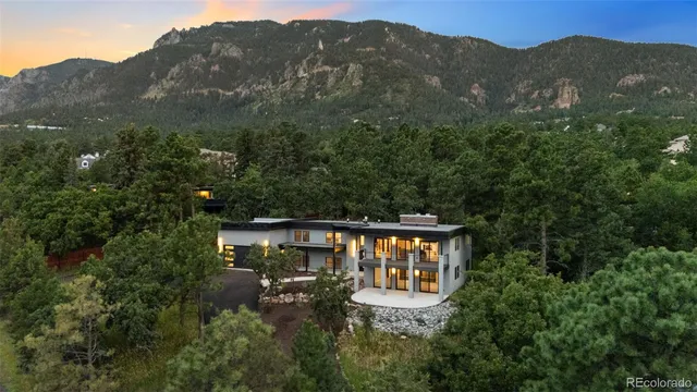 an aerial view of a house with mountain view