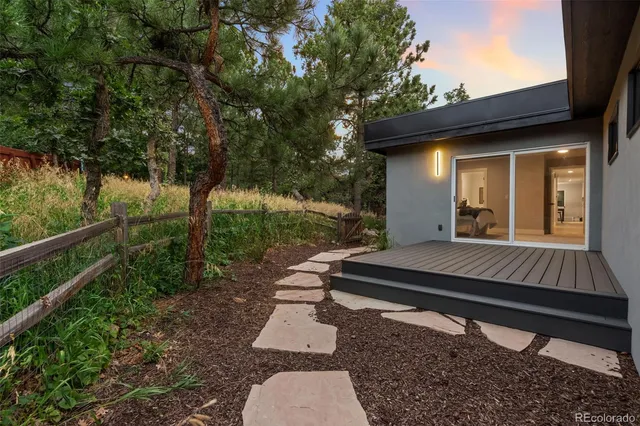 a view of a bench in the backyard