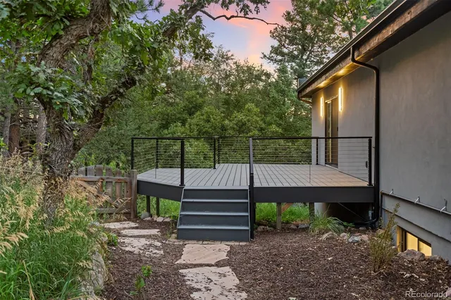 a view of house with wooden floor and a bench