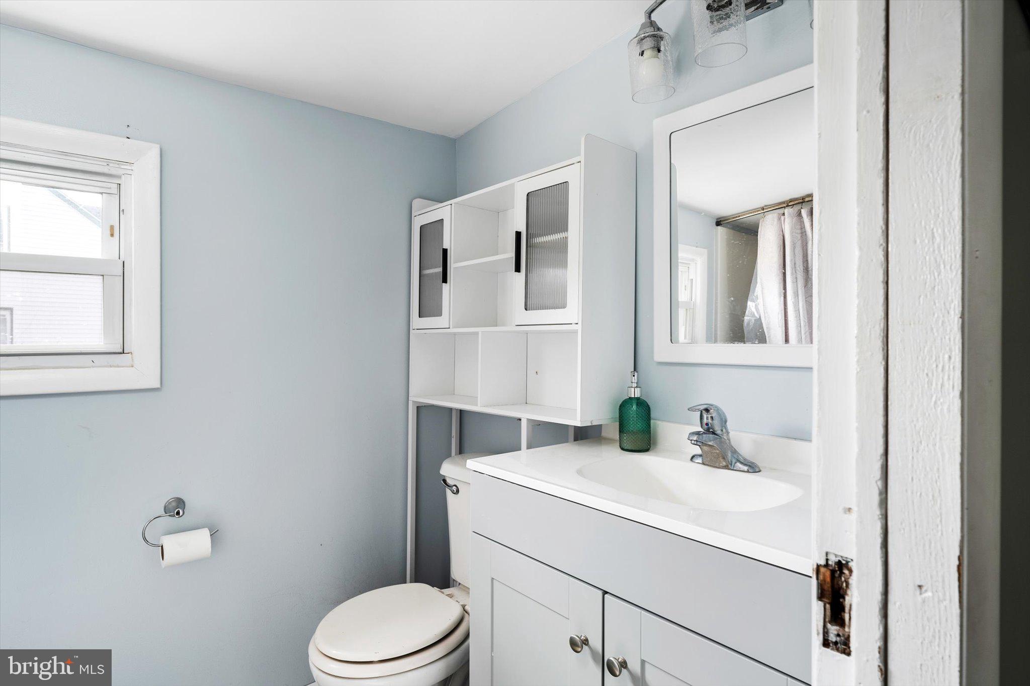 22 Brainerd Street Mount Holly, NJ 08060 - Photo 15 of 20 a bathroom with a sink toilet and mirror