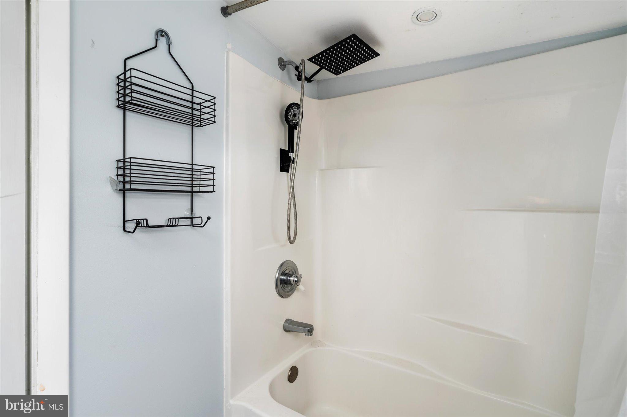 22 Brainerd Street Mount Holly, NJ 08060 - Photo 16 of 20 a bathroom with a bathtub and a shower