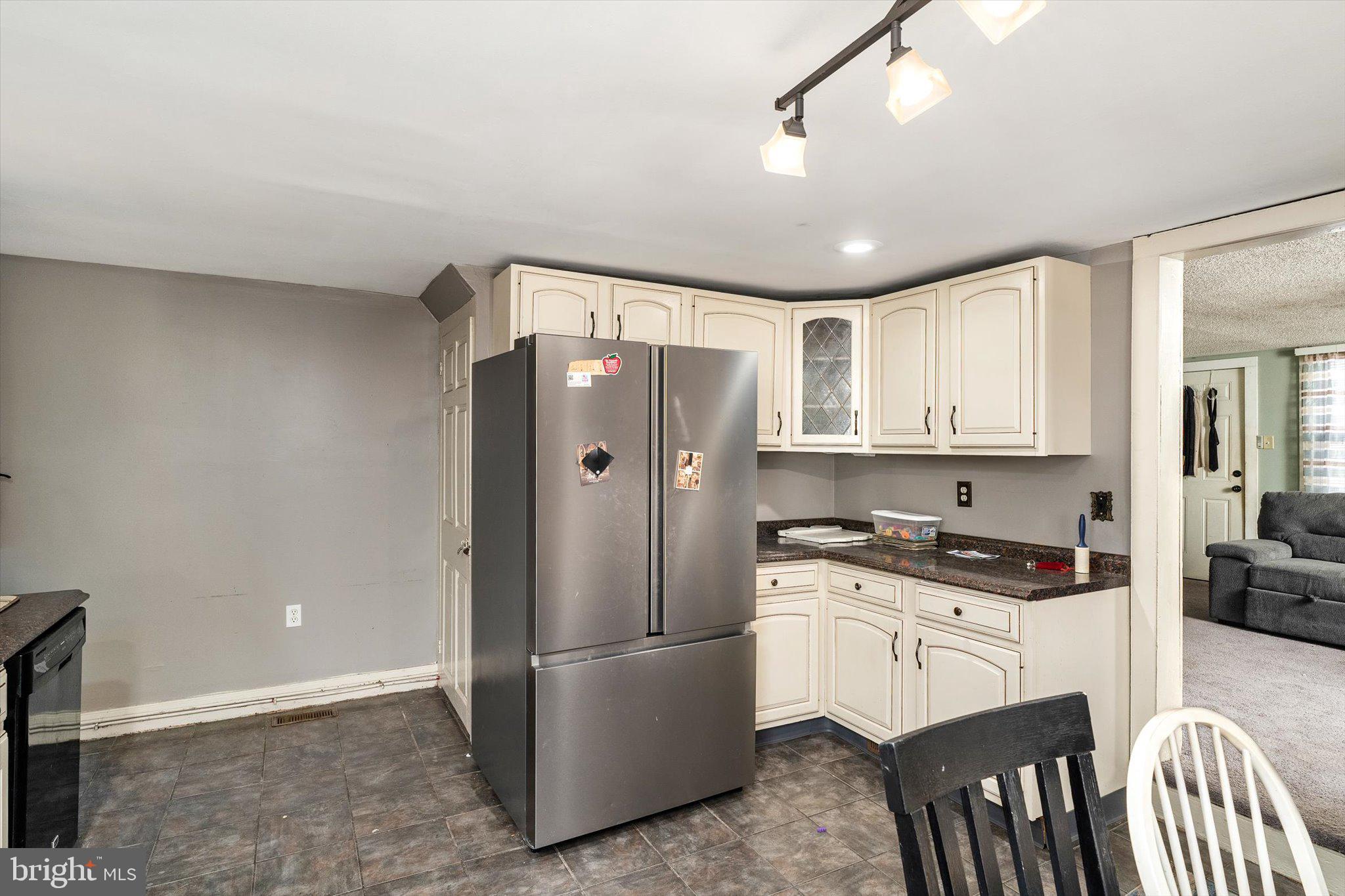 22 Brainerd Street Mount Holly, NJ 08060 - Photo 20 of 20 a kitchen with stainless steel appliances granite countertop a refrigerator a stove a sink and a microwave
