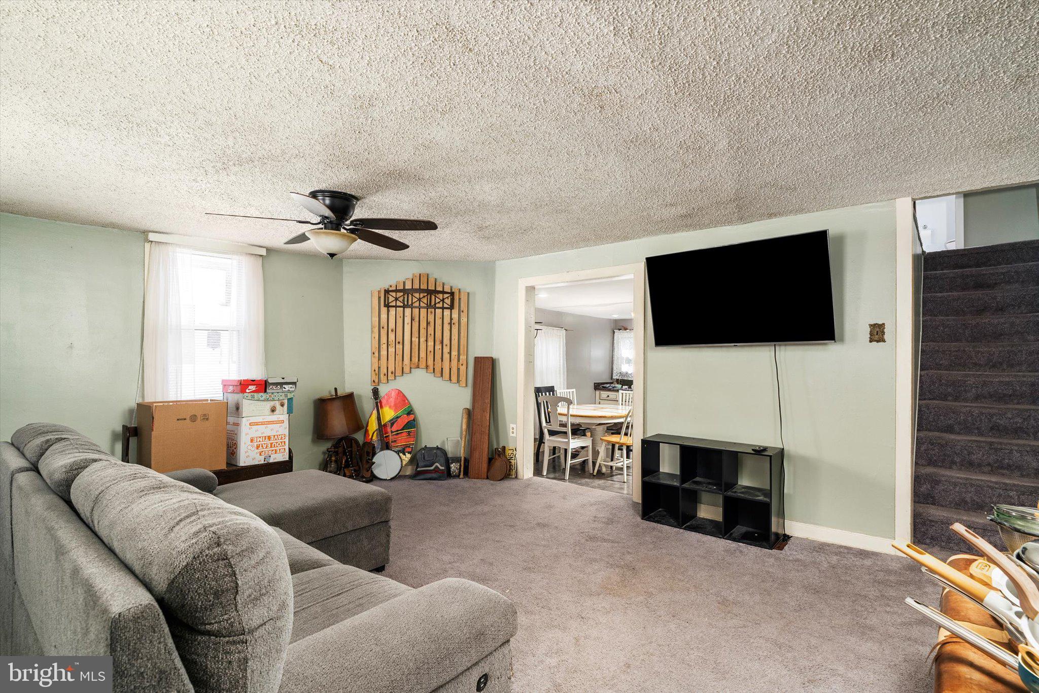 22 Brainerd Street Mount Holly, NJ 08060 - Photo 2 of 20 a living room with furniture and a flat screen tv