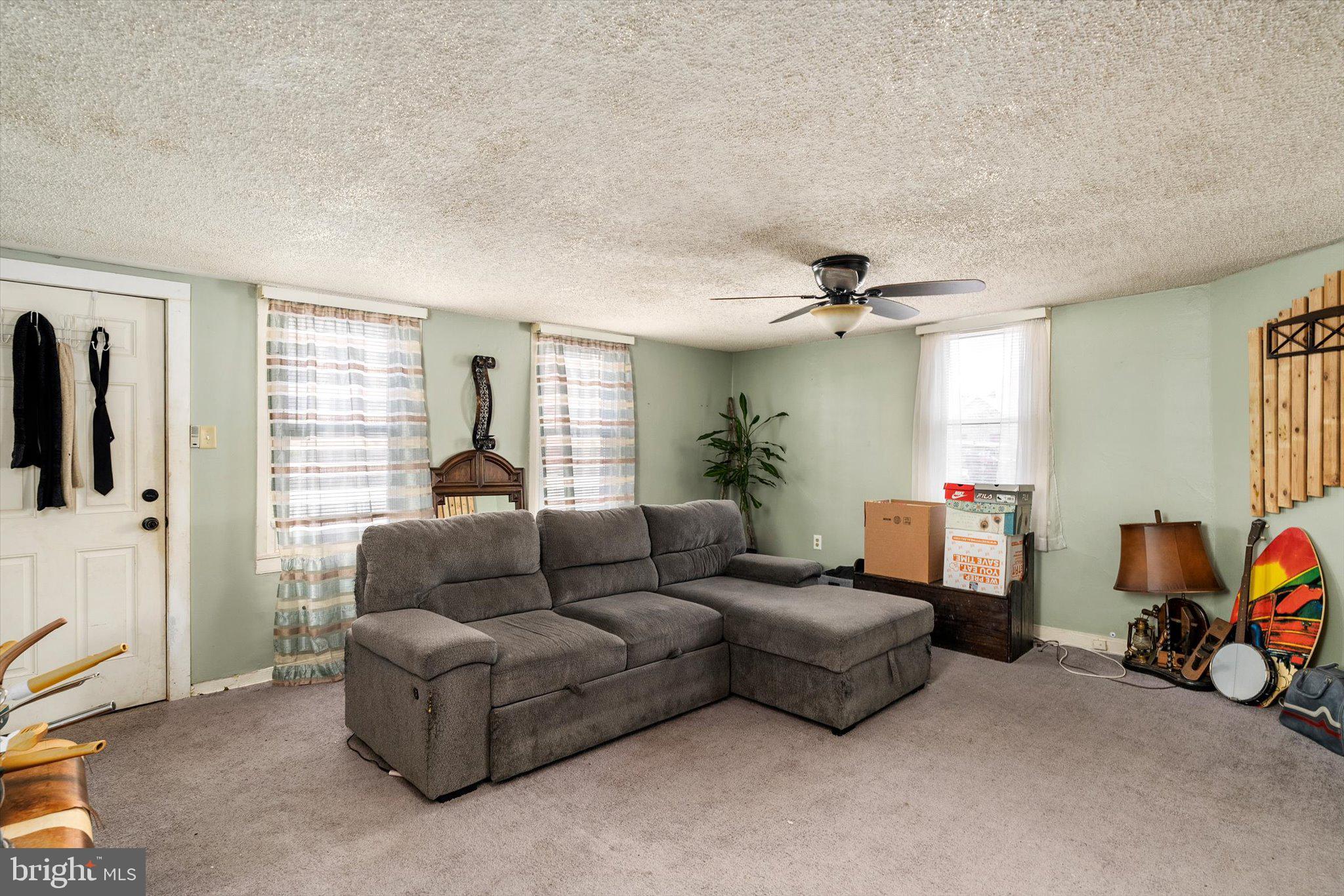 22 Brainerd Street Mount Holly, NJ 08060 - Photo 3 of 20 a living room with furniture and a window