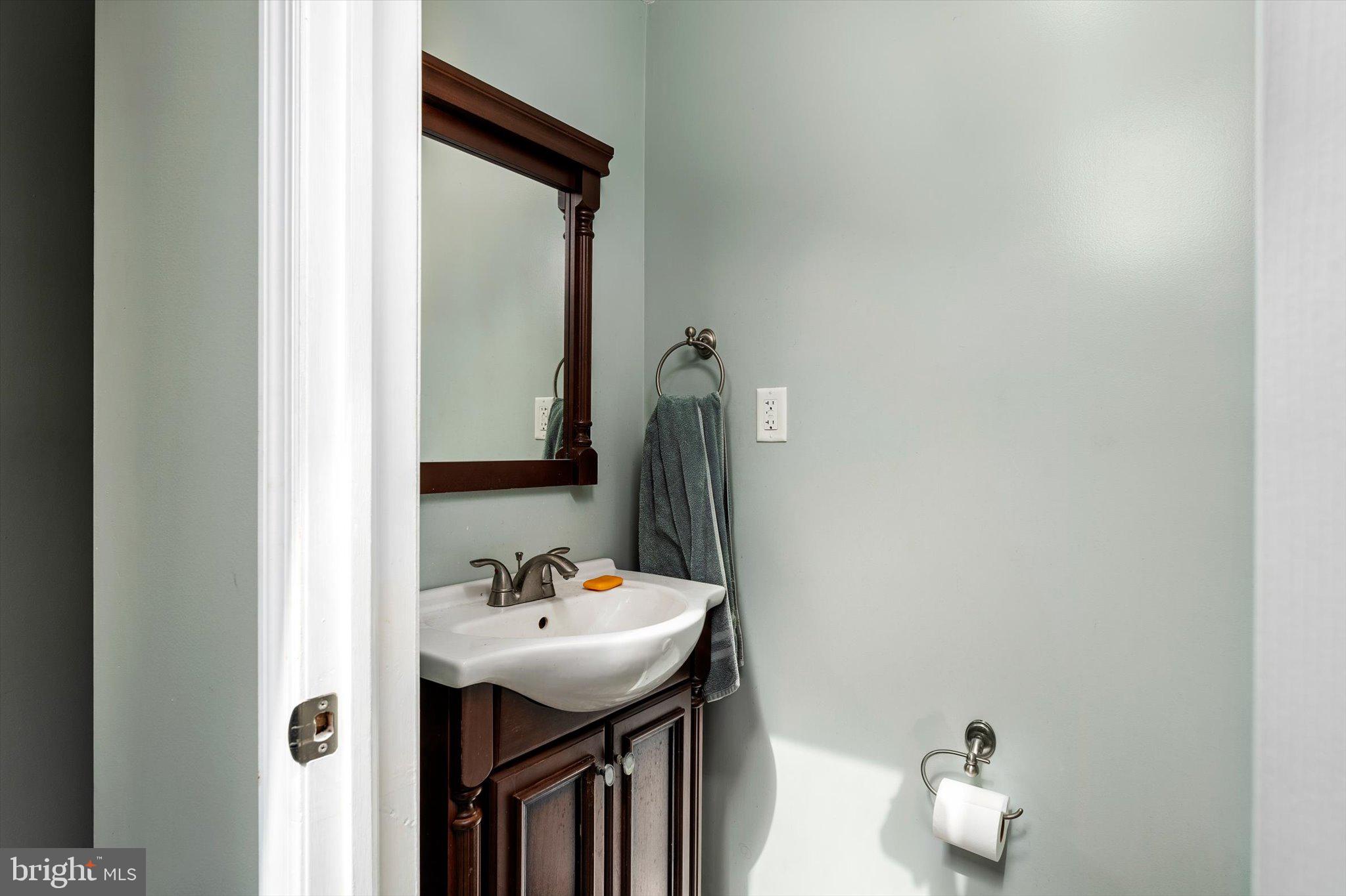 22 Brainerd Street Mount Holly, NJ 08060 - Photo 9 of 20 a bathroom with a sink and a mirror
