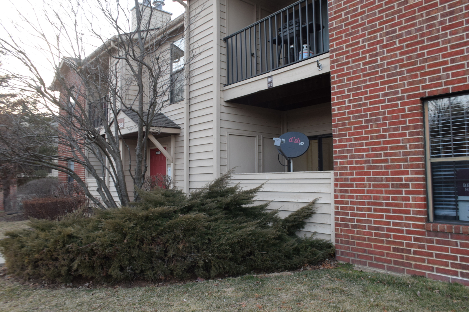 1959 North Hicks Road, Unit 103 Palatine, IL 60074 - Photo 2 of 22 a view of a house with a yard