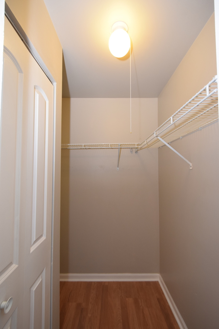 1959 North Hicks Road, Unit 103 Palatine, IL 60074 - Photo 12 of 22 a view of a room with racks on the wall