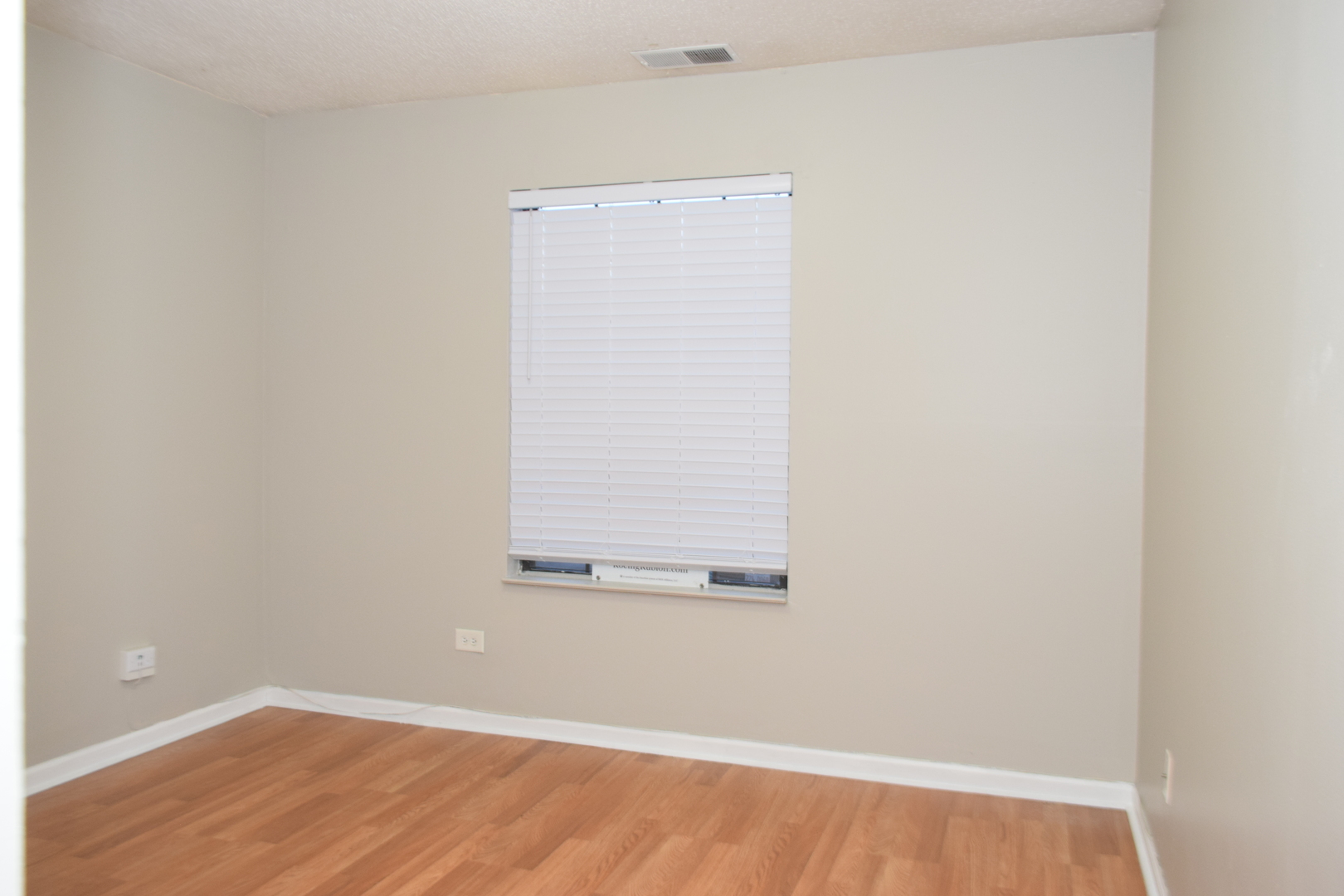 1959 North Hicks Road, Unit 103 Palatine, IL 60074 - Photo 16 of 22 a view of a small space with wooden floor and a window