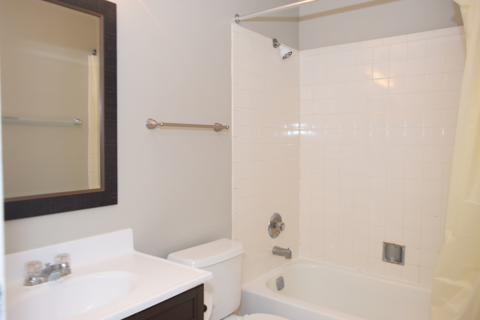1959 North Hicks Road, Unit 103 Palatine, IL 60074 - Photo 18 of 22 a bathroom with a sink a toilet and shower