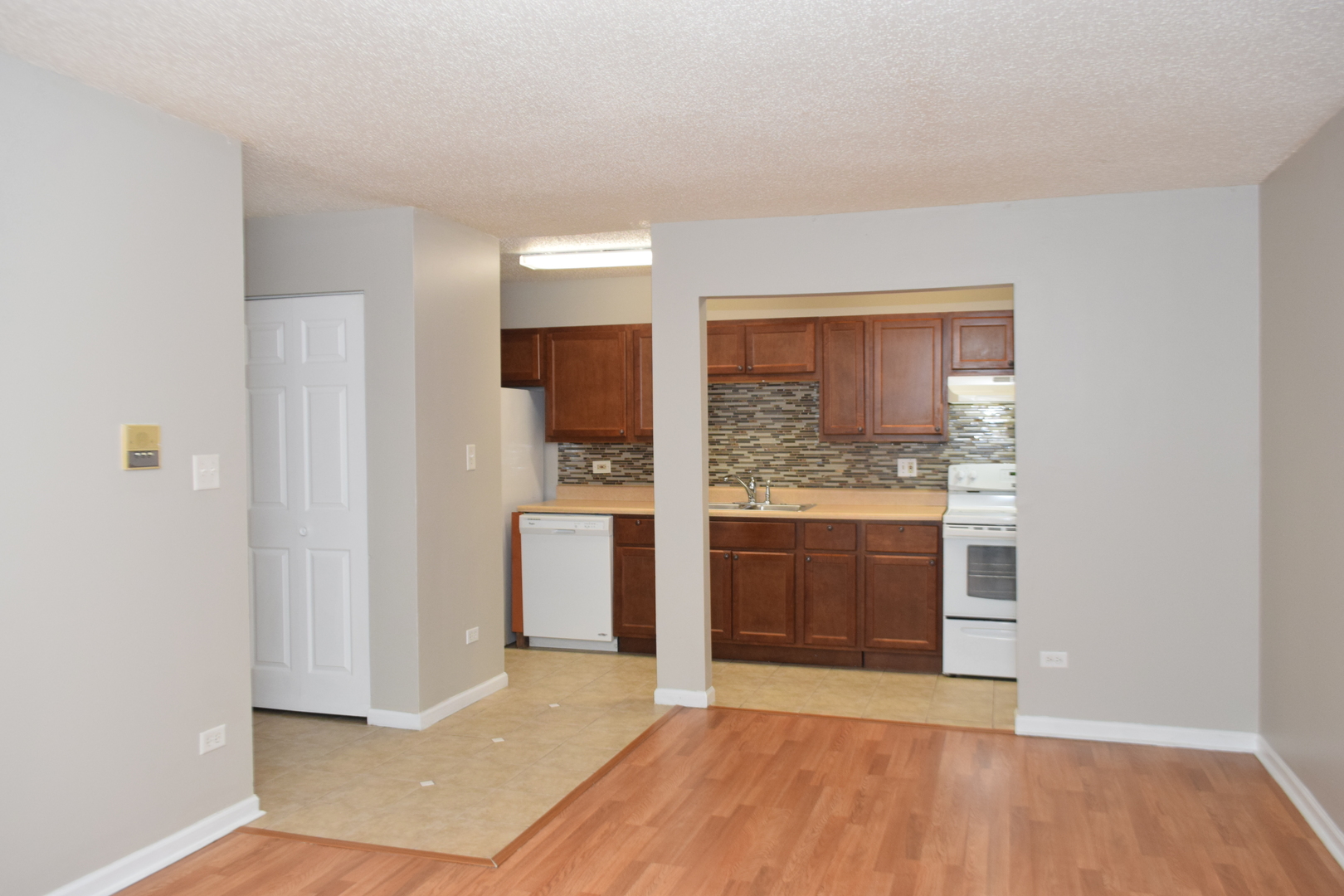 1959 North Hicks Road, Unit 103 Palatine, IL 60074 - Photo 5 of 22 a view of a kitchen with a sink and a stove top oven