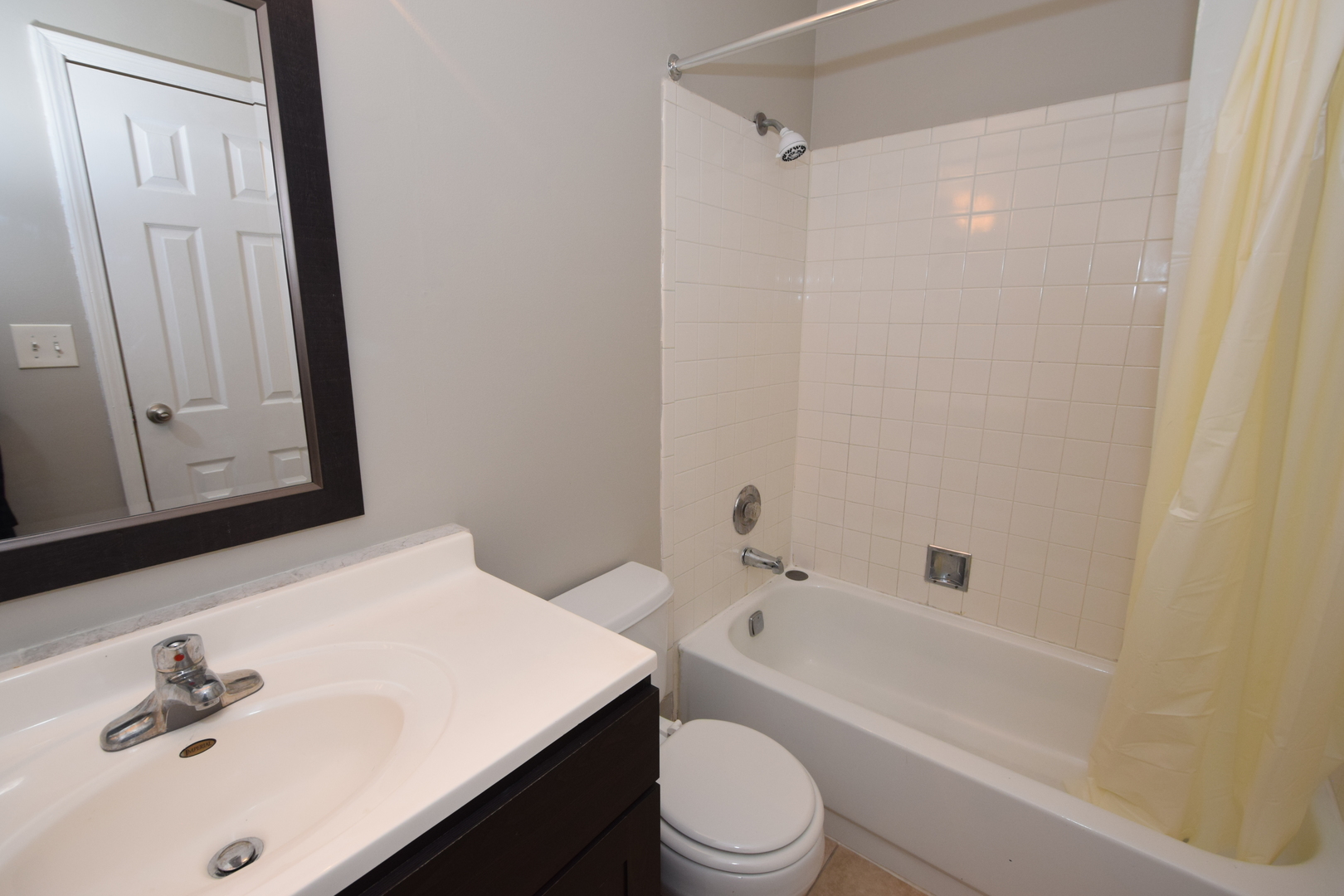 1959 North Hicks Road, Unit 103 Palatine, IL 60074 - Photo 9 of 22 a bathroom with a sink a toilet and shower