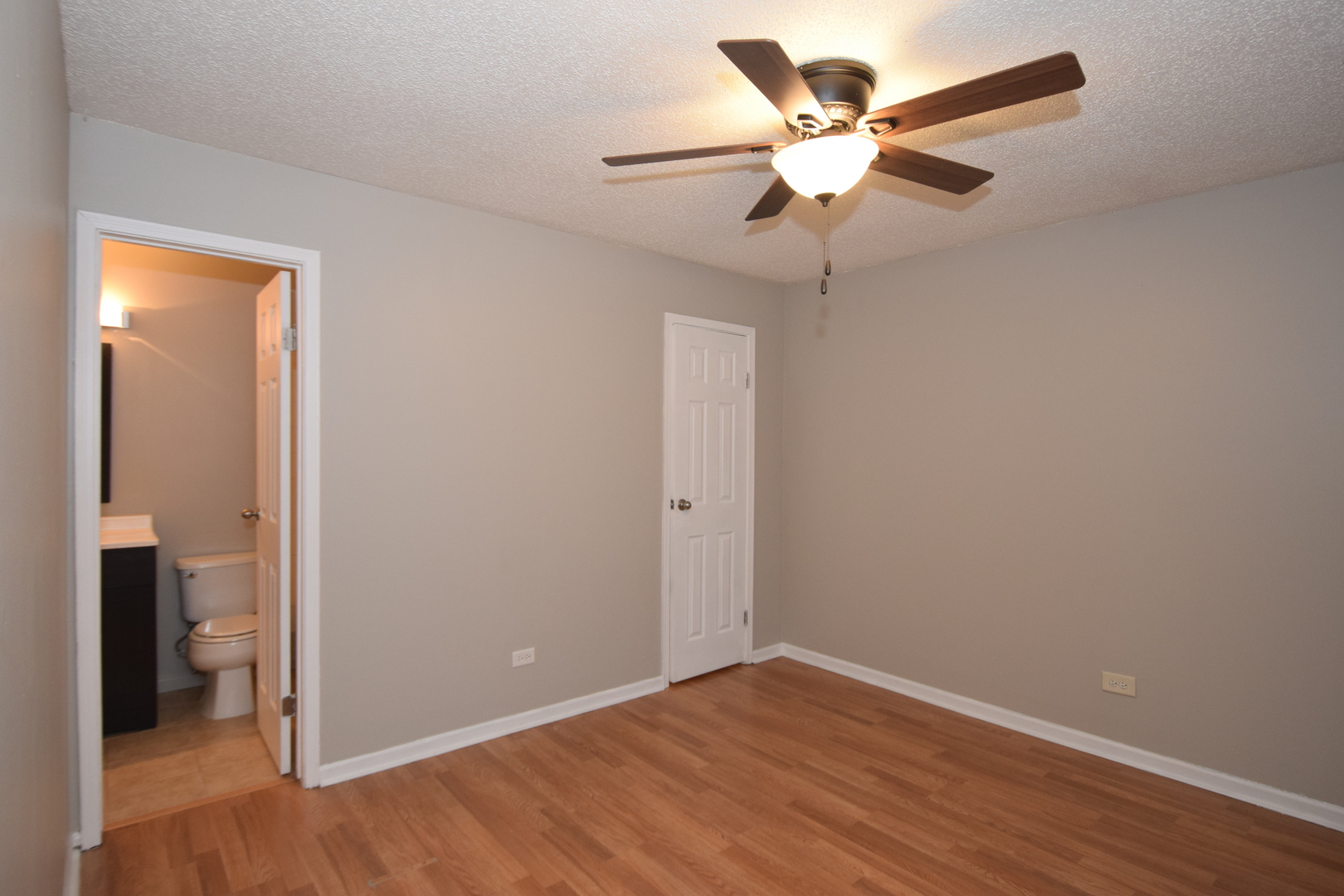 1959 North Hicks Road, Unit 103 Palatine, IL 60074 - Photo 10 of 22 wooden floor in an empty room