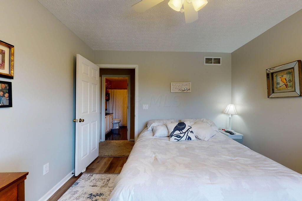 1300 Hubbard Road Galloway, OH 43119 - Photo 37 of 89 • New luxury vinyl plank flooring ~ 2022 • Grey painted walls • Lighted ceiling fan • Single door closet • Mini blinds