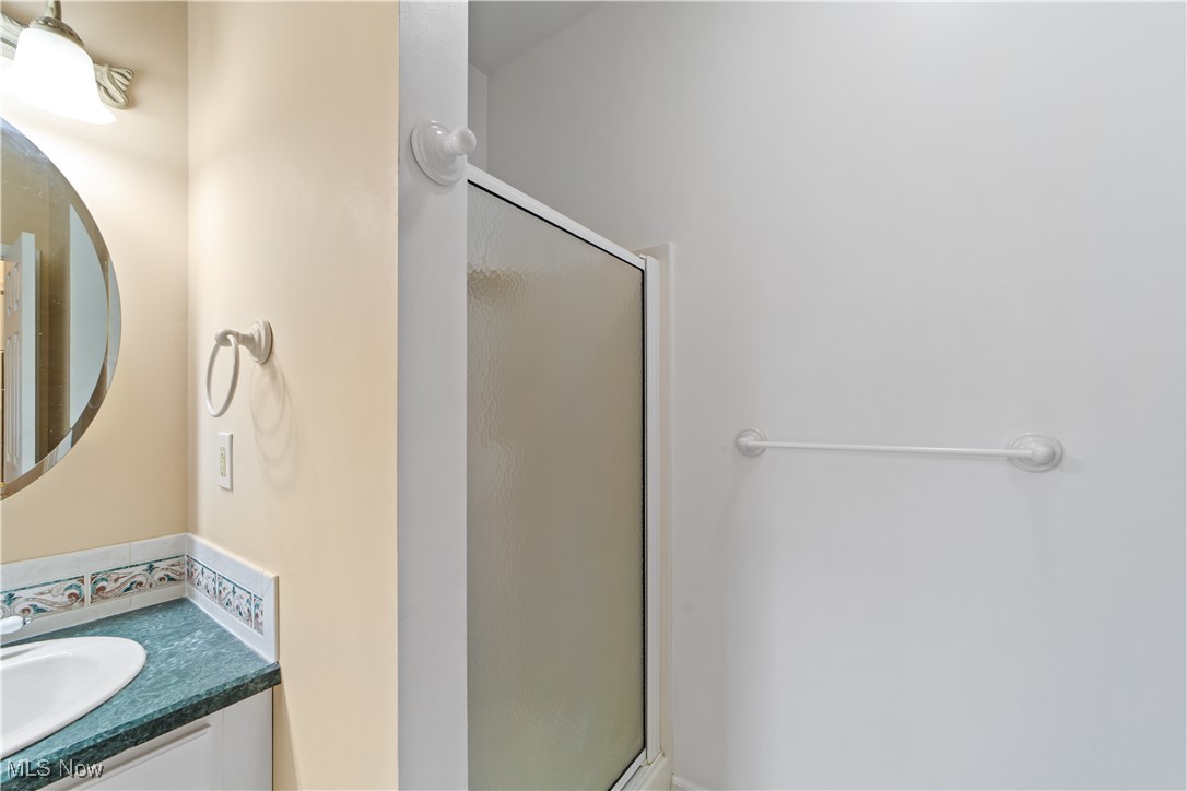 4461 Sexton Road Cleveland, OH 44105 - Photo 18 of 47 Primary bathroom featuring vanity and a shower stall