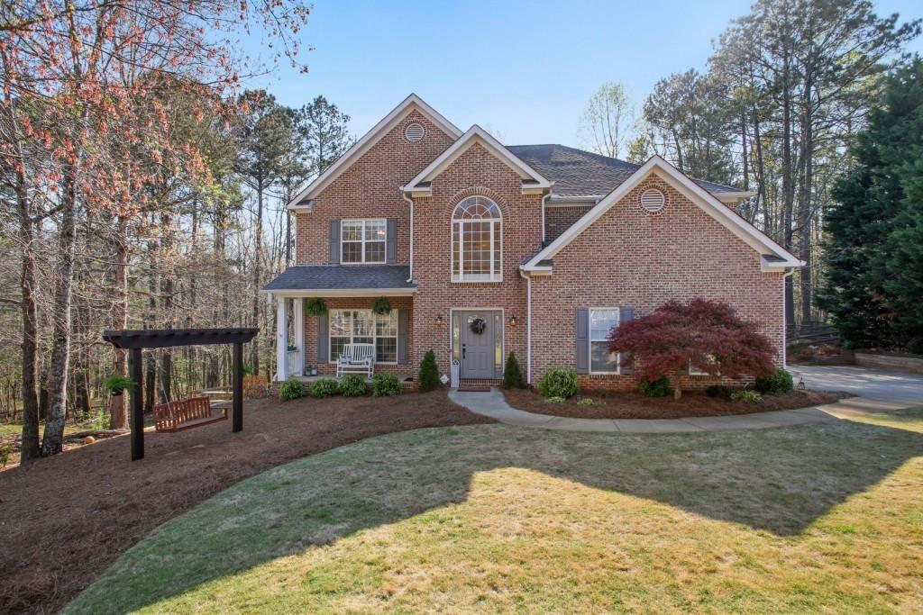 3761 Falls Trail Winston, GA 30187 - Photo 1 of 45 a front view of a house with a yard and garage