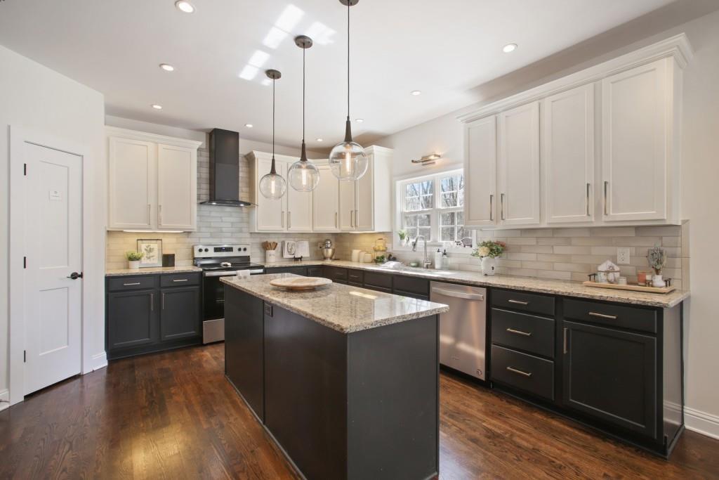 3761 Falls Trail Winston, GA 30187 - Photo 12 of 45 a kitchen with stainless steel appliances granite countertop a sink a stove and a refrigerator
