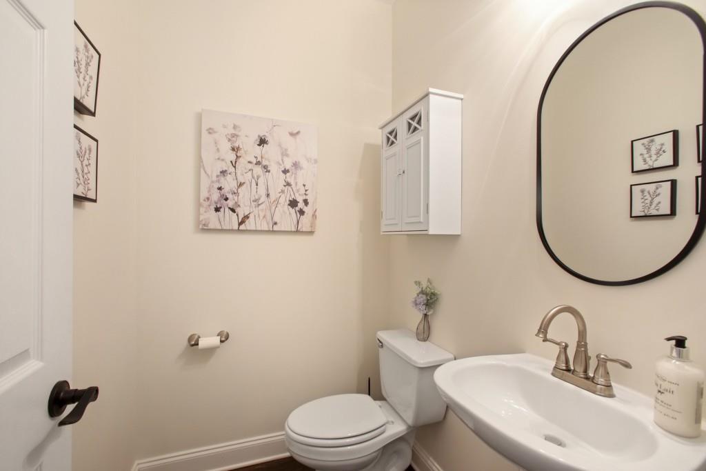 3761 Falls Trail Winston, GA 30187 - Photo 15 of 45 a bathroom with a toilet sink and mirror