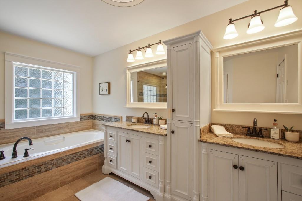 3761 Falls Trail Winston, GA 30187 - Photo 16 of 45 a bathroom with a granite countertop tub sink double vanity window and mirror