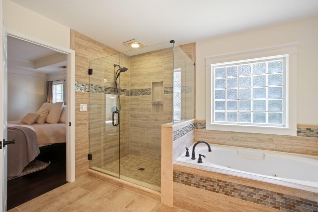 3761 Falls Trail Winston, GA 30187 - Photo 17 of 45 a bathroom with a granite countertop tub shower and mirror