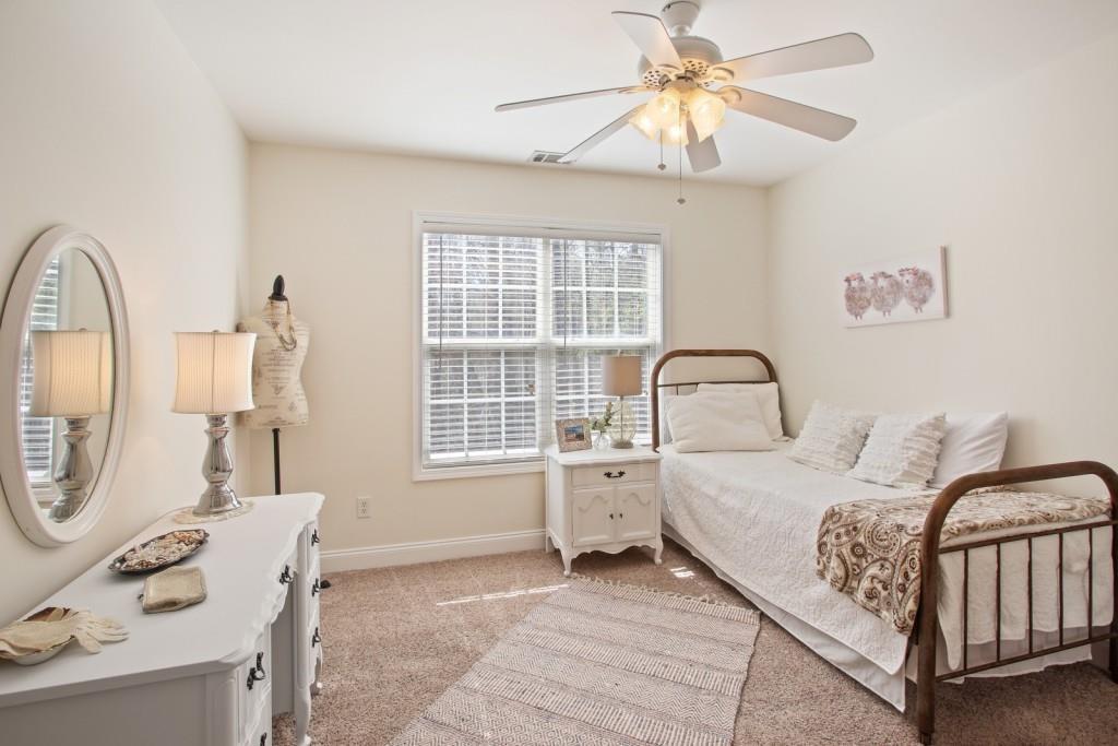 3761 Falls Trail Winston, GA 30187 - Photo 25 of 45 a bedroom with a bed couch and a window