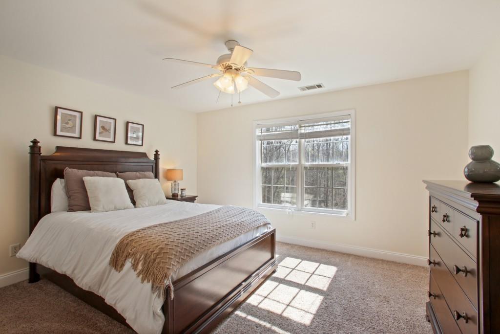 3761 Falls Trail Winston, GA 30187 - Photo 27 of 45 a spacious bedroom with a bed and a window